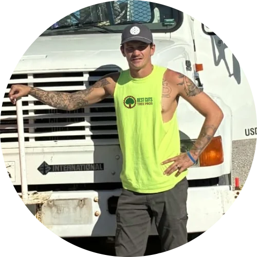Tyler Franklin, owner of Best Cuts Tree Pros, standing in front of his work truck